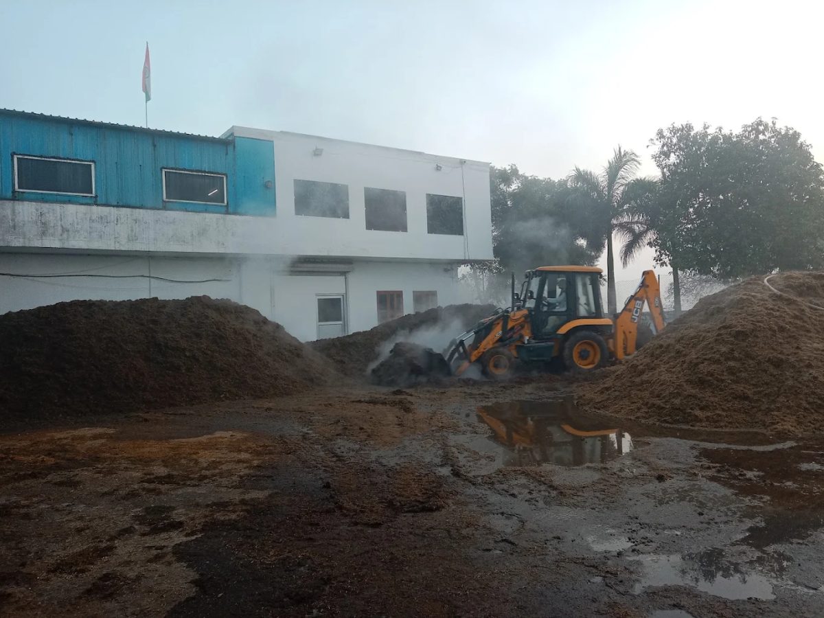 Compost being turned for mushroom cultivation at the farm yard