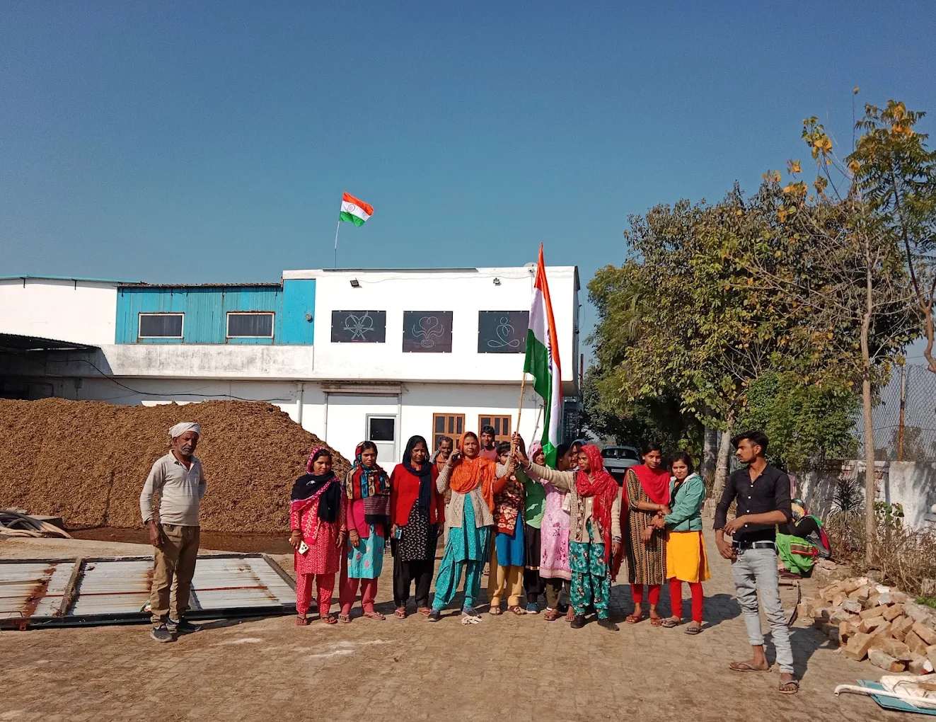 Divin Mushroom Farm team outside the farm building in Barona, Kharkhoda, Haryana